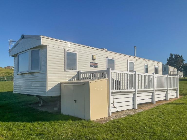 ABI New Horizon 2021 static caravan sited at Allhallows, Kent. 3 bedrooms, deck
