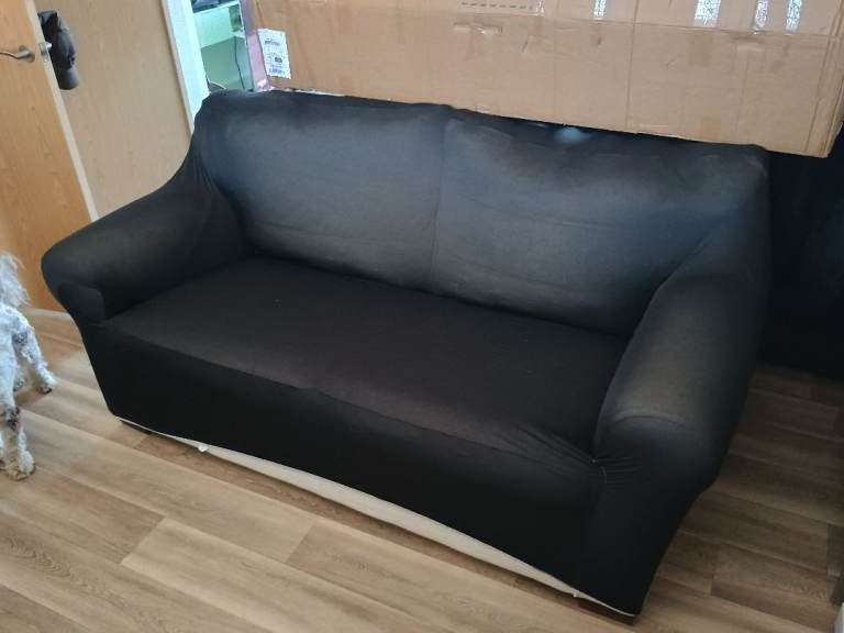 Cream Two-Seater Sofa with Fabric Cover – Good Condition