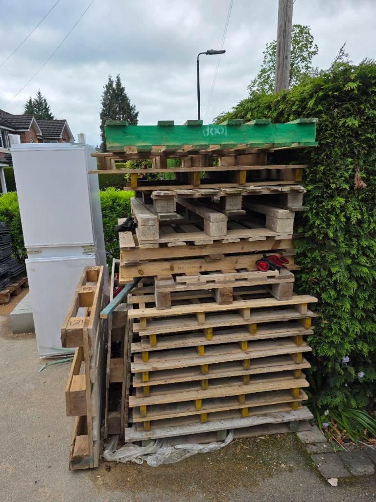 Stack of Used Wooden Pallets - Various Sizes