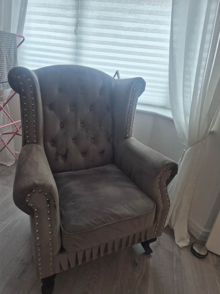 Grey plush wingback chair 