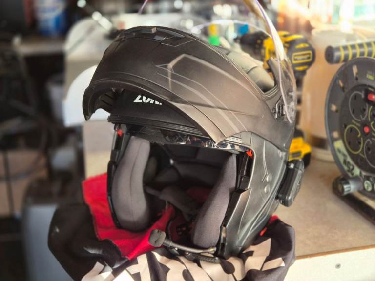Flip face crash helmet with comms unit