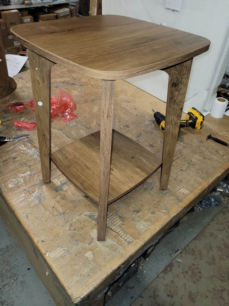 A new lovley dark wood effect side table with lower shelve. 