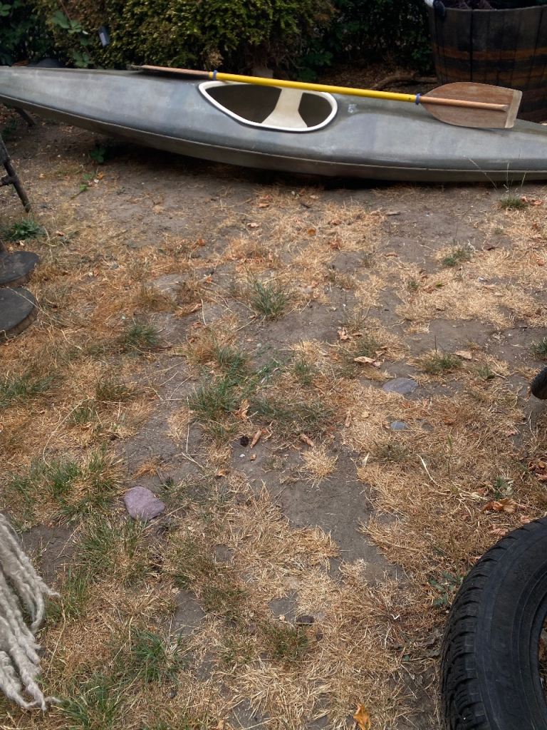 Green Kayak with Paddle – Good Condition