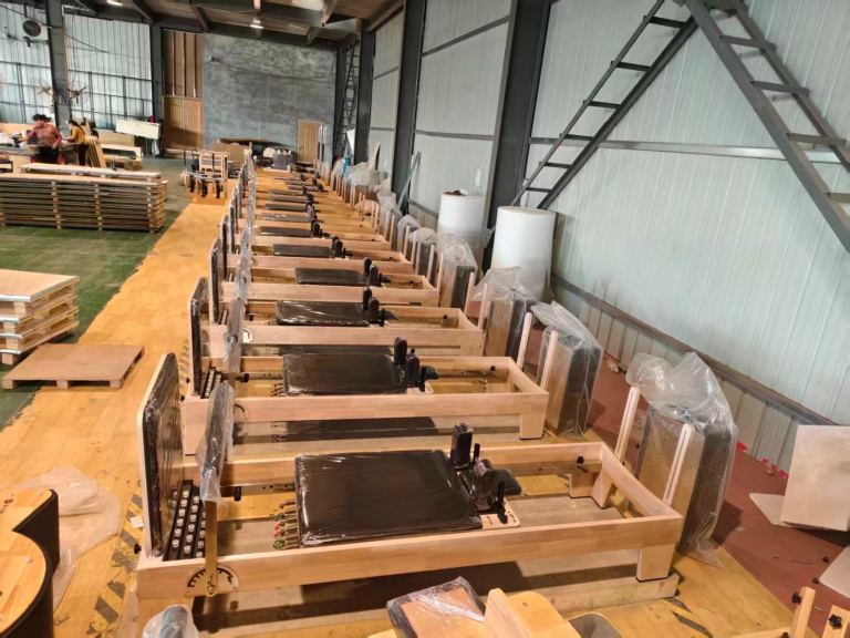 6x NONE foldable black oak Pilates reformers 