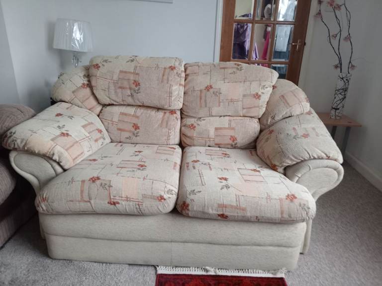 Lovely condition two seater sofa in beige/brown floral material