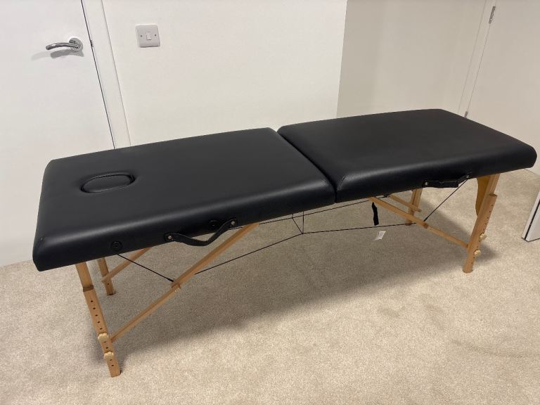 Folding portable massage table