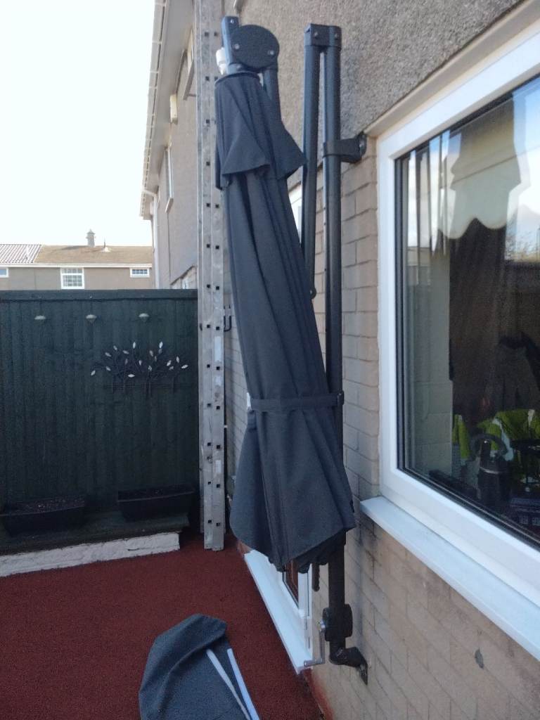 Parasol. Large wall mounted heavy duty parasol. 