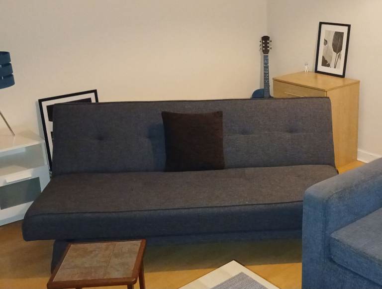 Grey "Click Clack" Folding Sofa Bed.