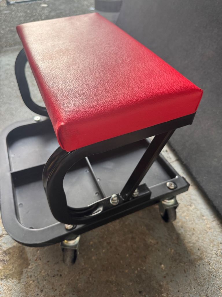 Inspection seat with tool tray underneath 