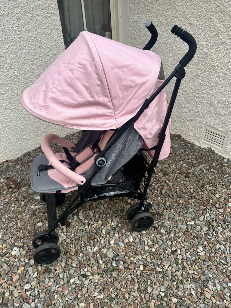 Pink pushchair 