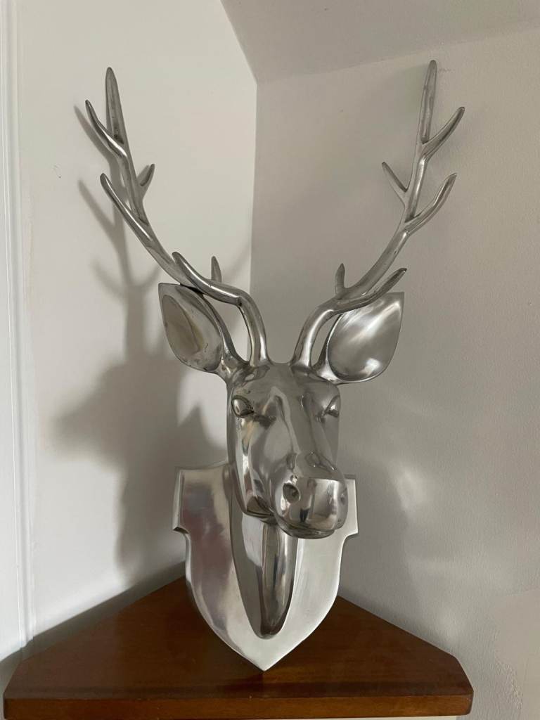 Decorative deer head for wall mounting