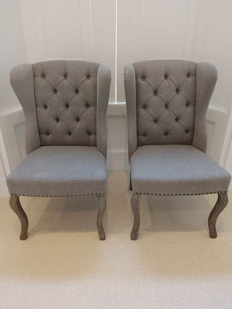 Pair of Modern Wing Chairs With Nailhead Detail