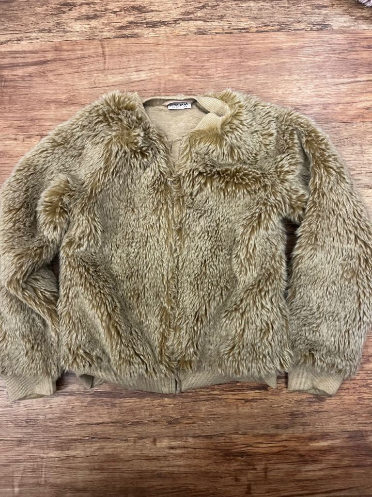 A girls fluffy jacket from NEXT