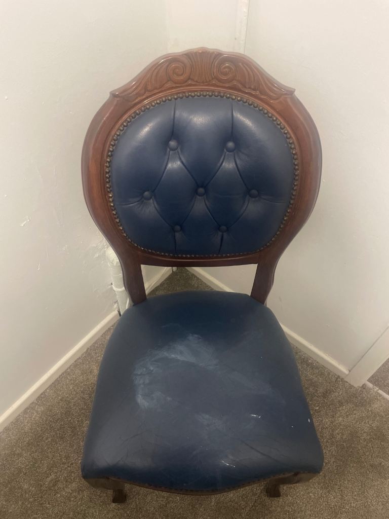 Blue leather chair with wooden