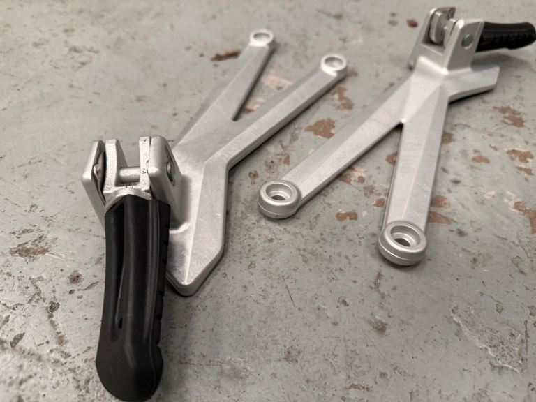 Husqvarna 701 Supermoto Enduro OE rear numberplate housing, grab rails and rear seat pegs.