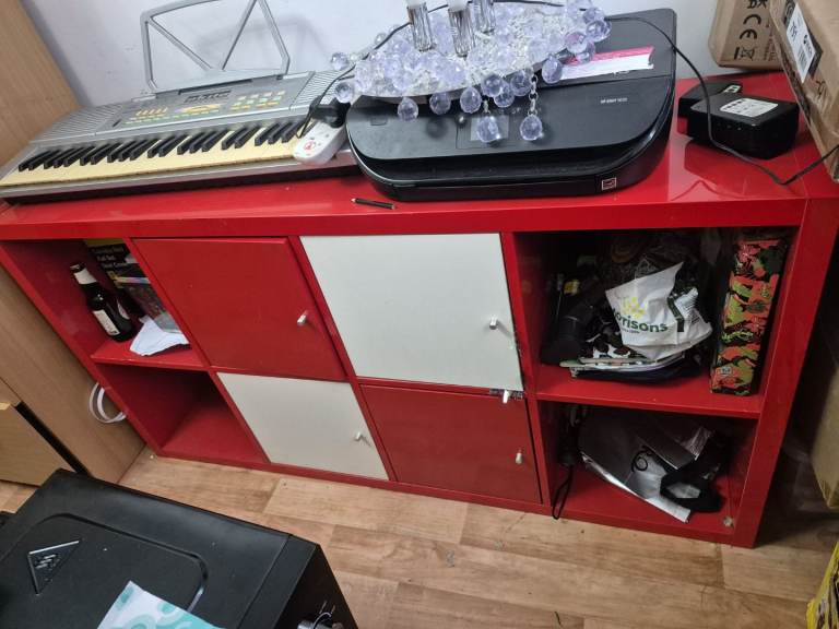 Red and white storage cabinet for sale. 