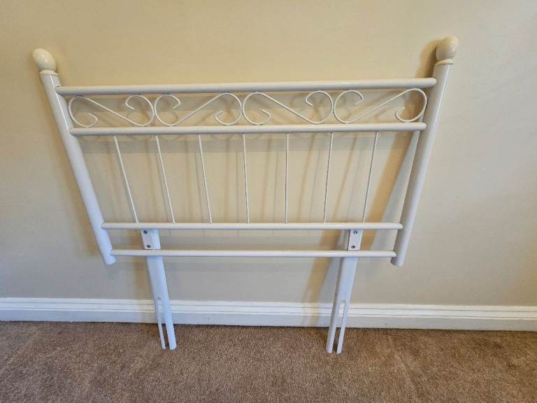 Metal headboard, single bed.
