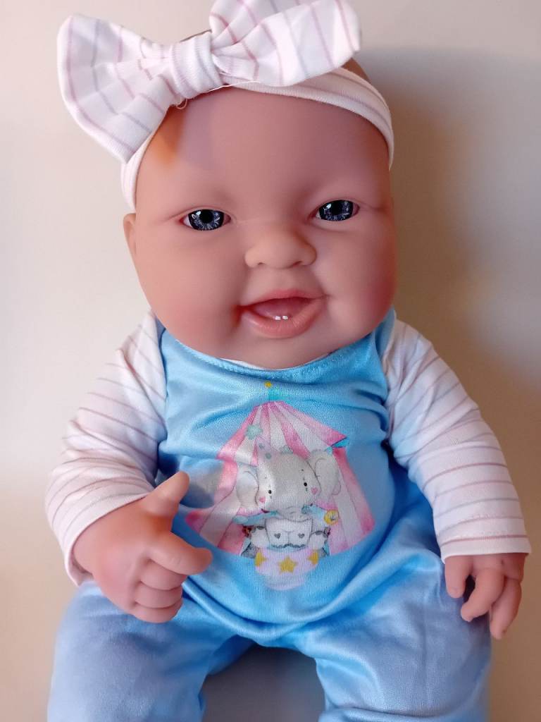 BERENGUER Life like baby doll with 4 outfits. 