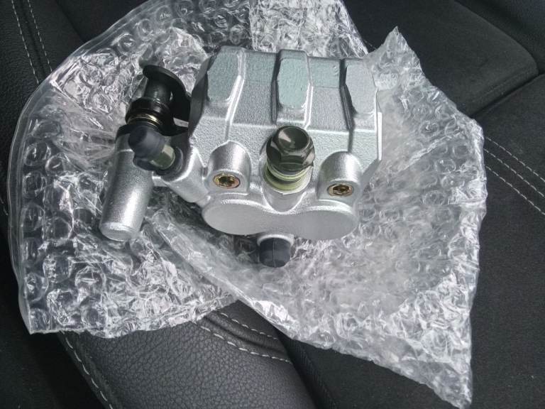 Sym front brake caliper brand new 