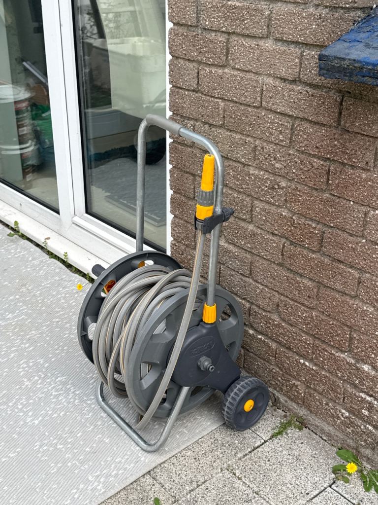 Hose pipe on trolley hozelock
