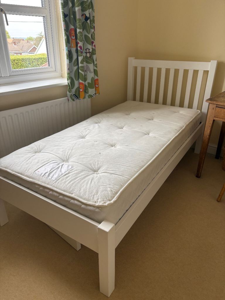 2 single beds with mattresses