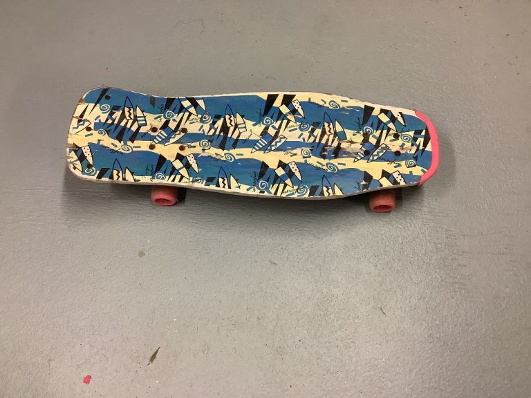 Vintage Skateboard with Blue and Yellow Pattern – Good Condition