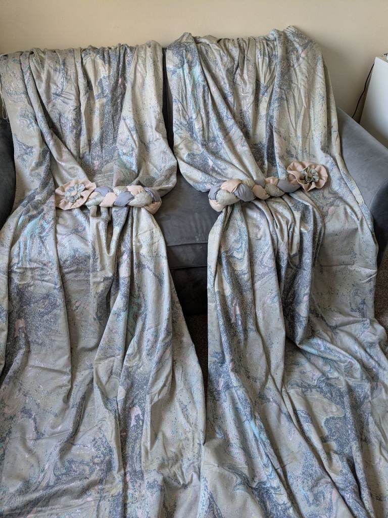 Two pairs of Light Coloured Patterned Curtains with Tie Backs