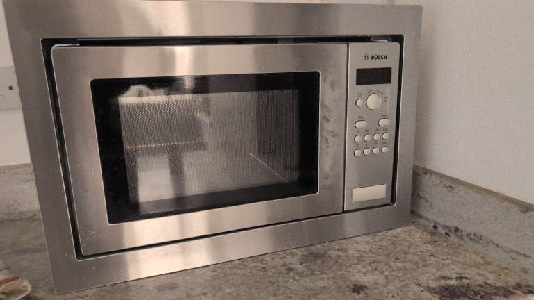 Bosch double oven, glass hob, fridge freezer and dishwasher.