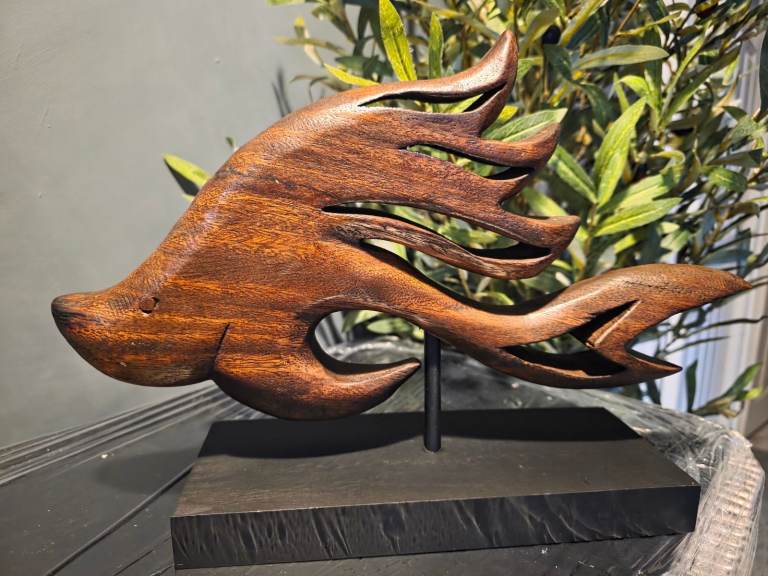 Fish on a plinth ornament 