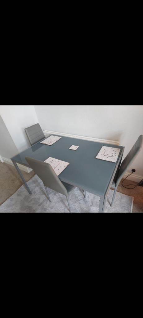 Dining glass Table with 4 chairs - grey colour 