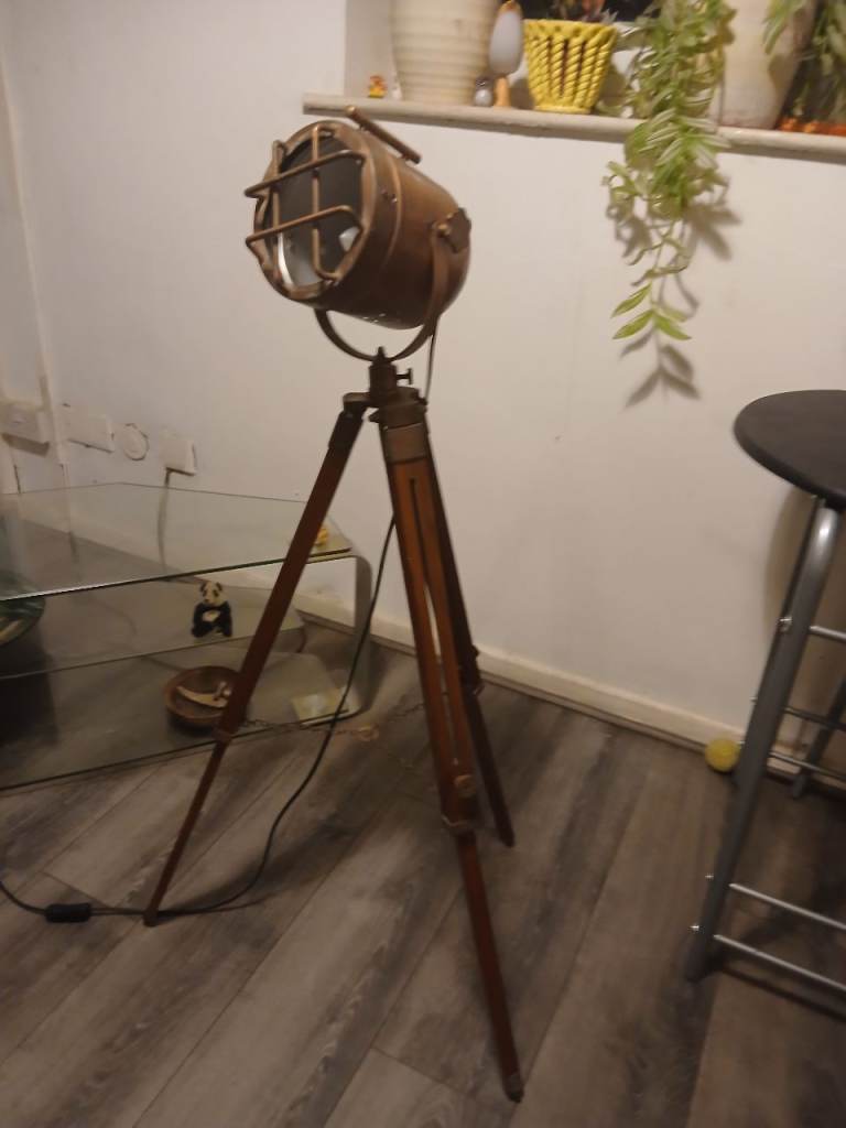 Table and chairs and tripod lamp