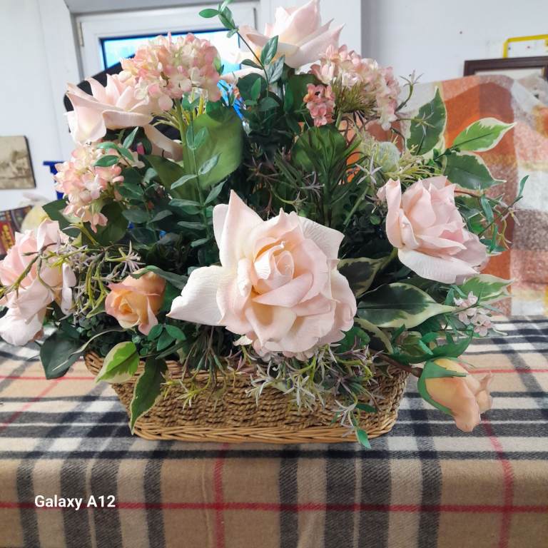 Artificial flowers in a basket 