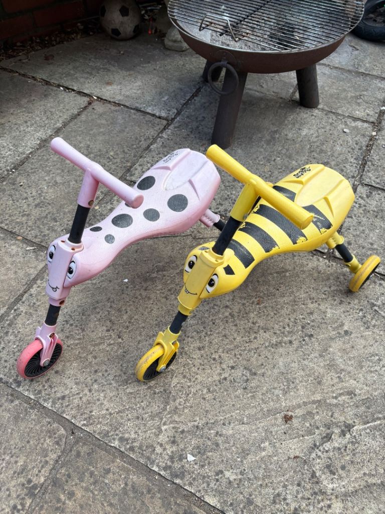 Two Scuttlebug ride on bikes