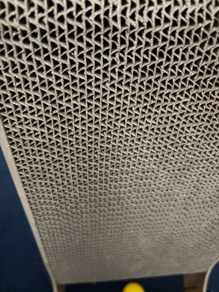 IKEA Utsadd cat house and L shaped layered cardboard cat scratching post