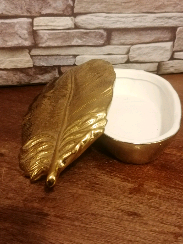 Gold colour jewellery trinket box. 