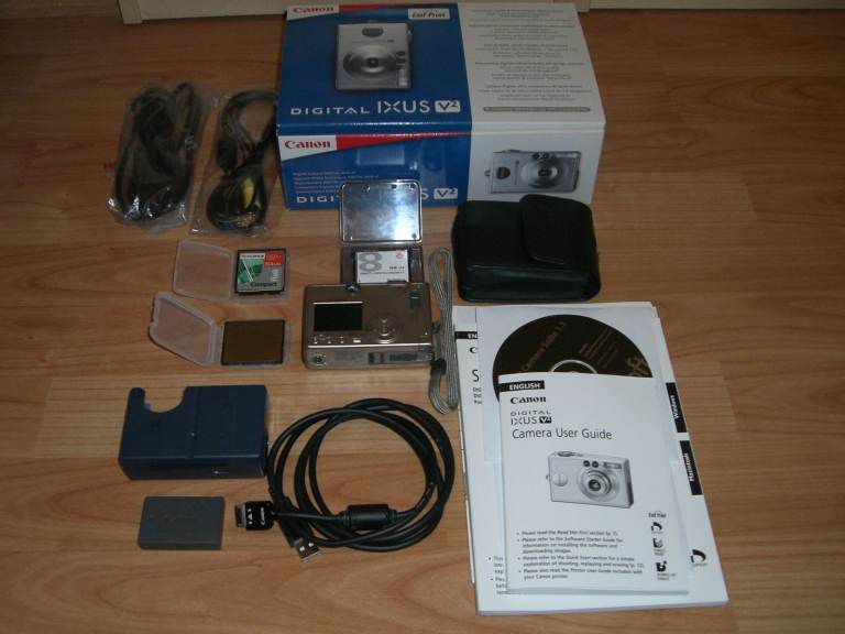 CANON IXUS V2 DIGITAL CAMERA in ORGINAL BOX and MEMORY CARDS