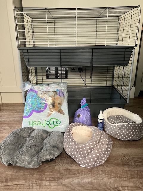 A two-level cage for guinea pigs and other accessories