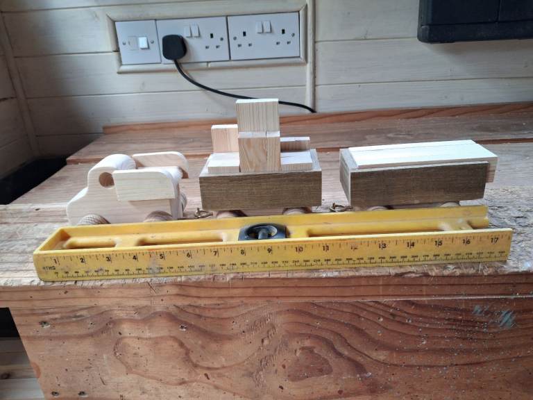 Wooden car with trailers.