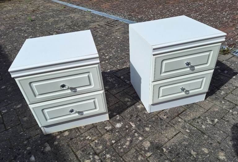 Hi, 2 used white bedside table.