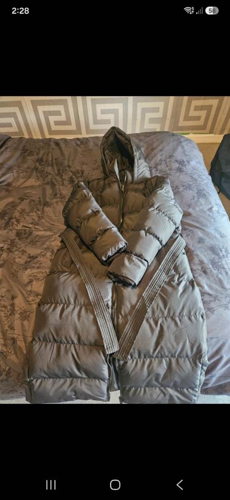 Women's long black puffer jacket with belt 