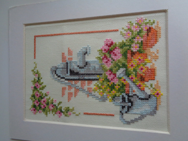 A French courtyard with water pump cross stitch picture