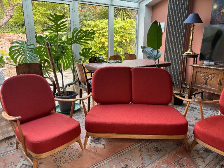 Classic mid-century 1960s Ercol blond beech-framed settee and two chairs model 203