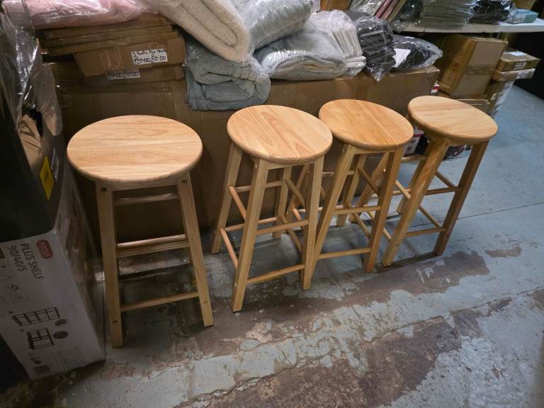 A set of 4 new wooden  kitchen stools ( one is a slight seconds) they are new and already built.