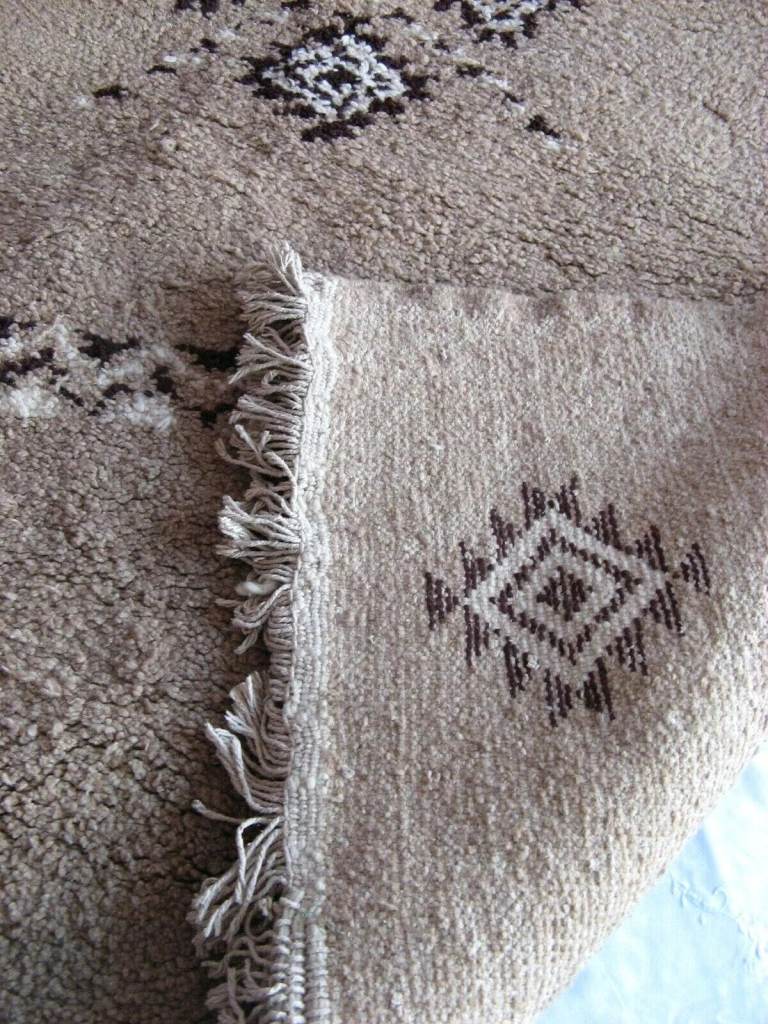 Moroccan 'Superior' hand knotted camel wool rug in natural colours. Not used.
