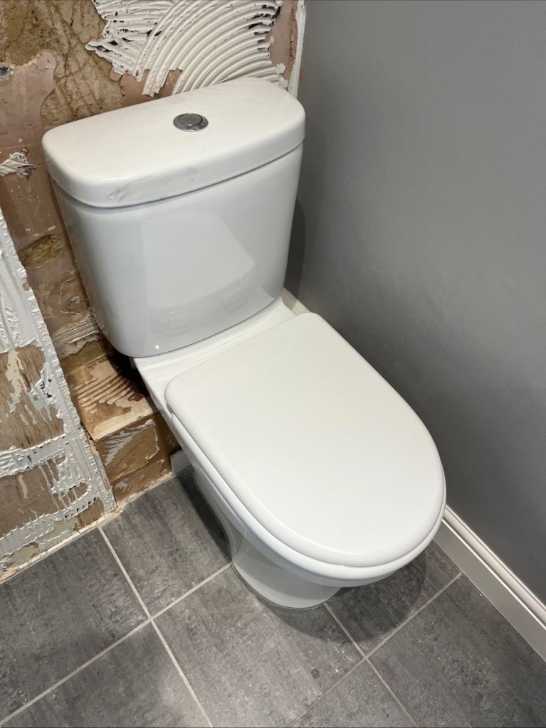 White Ceramic Toilet with Cistern and Seat – Good Condition