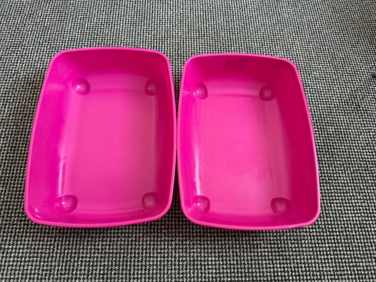2 pink cat litter trays and 2 cat dishes and cat toy