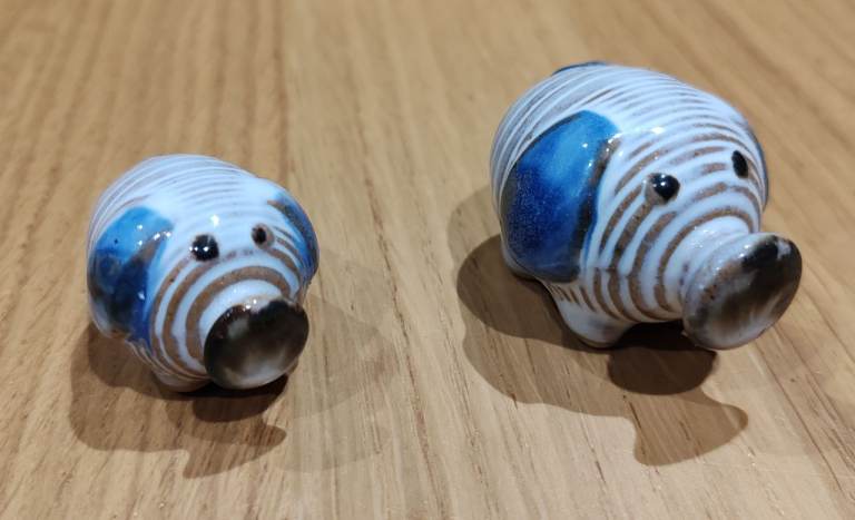 X2 Ceramic pigs.