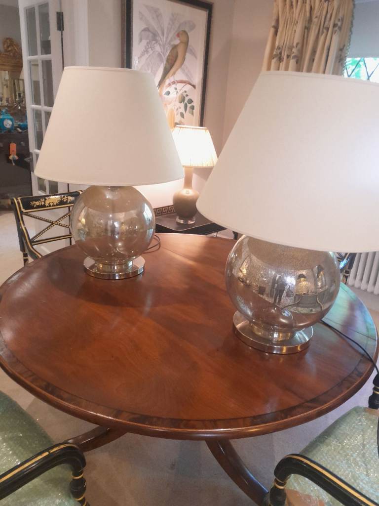 Pair large glass India jane table lamps with parchment shades.