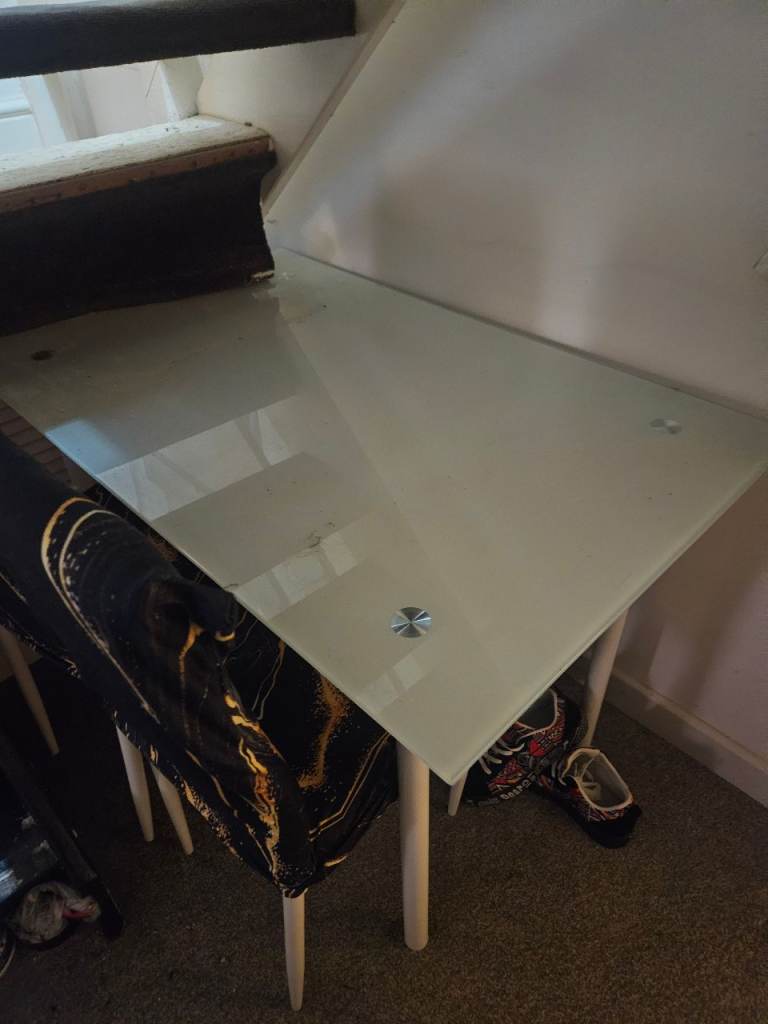 Glass table with 4 leather white chairs 