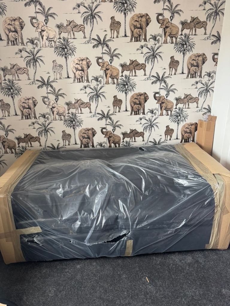 Black leather 2 seater sofa.